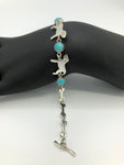 Sterling silver dog and bone with turquoise bracelet